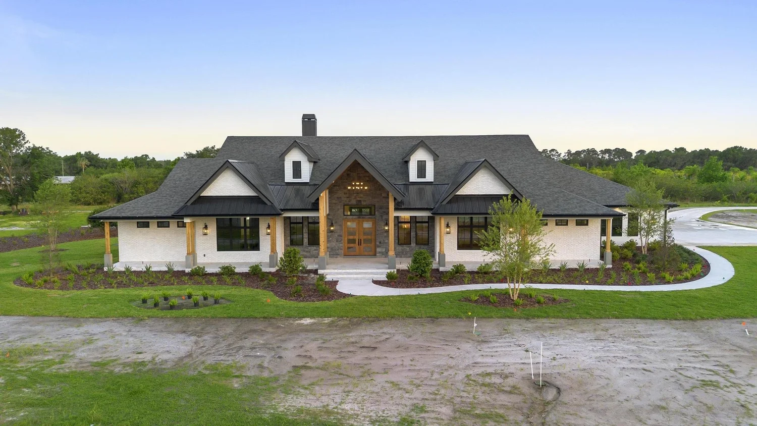 The Hammock custom home by Aulin Homes surrounded by mature Central Florida trees